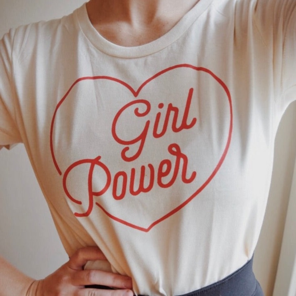 Slim fit the shirt with “Girl Power.” Never worn.